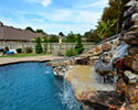 Freeform Custom Swimming Pool With Slide by Conway Pool Builders