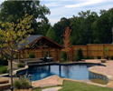 free form pool with tanning ledges