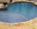 Custom Pool with Fire Bowls and Tanning Reef